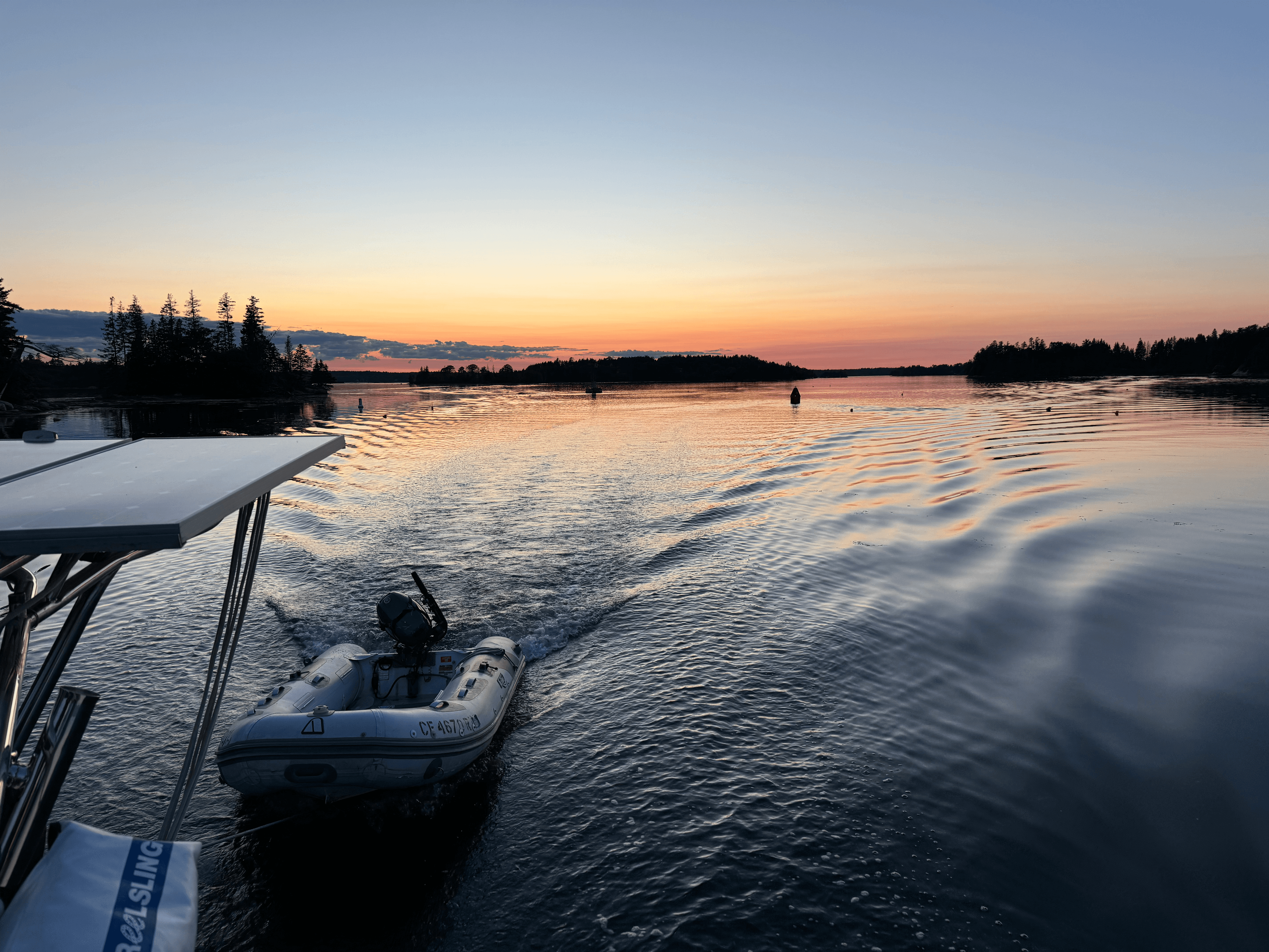 Illustration of a sailboat on calm blue water.